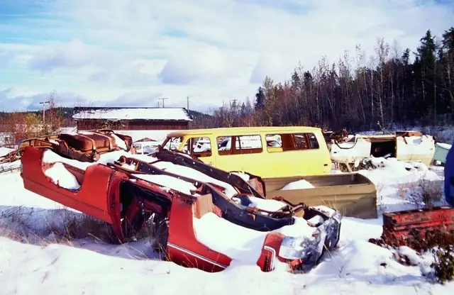 Car wrecks in the snow behind the motel